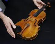 A rare 1719 viola called the "Macdonald" by Antonio Stradivari is displayed during a preview at the Sotheby's auction in Hong Kong Friday, April 4, 2014. A rare 1719 Stradivarius viola is expected to sell for more than US$45 million in a private sale by Sotheby's. The auction house says that price would be a record for a musical instrument sold privately or at auction. (AP Photo/Kin Cheung)