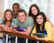 Group of college students leaning on banister